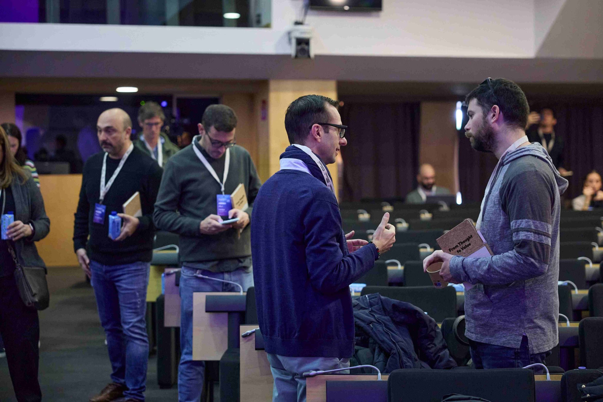 Attendees networking at the conference